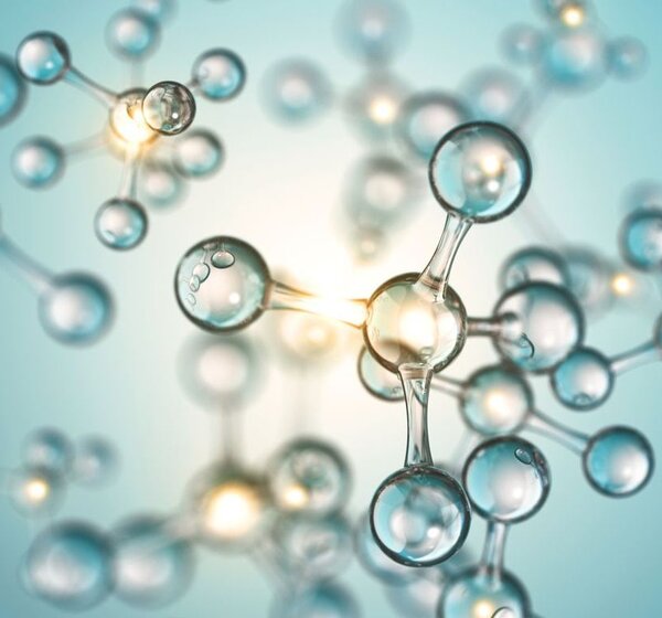 Image showing a 3D rendering of molecules in suspension.A close up of a 3D illustration of molecules in suspension. Against a light blue background float molecules, each composed of a central atom surrounded by four other atoms.