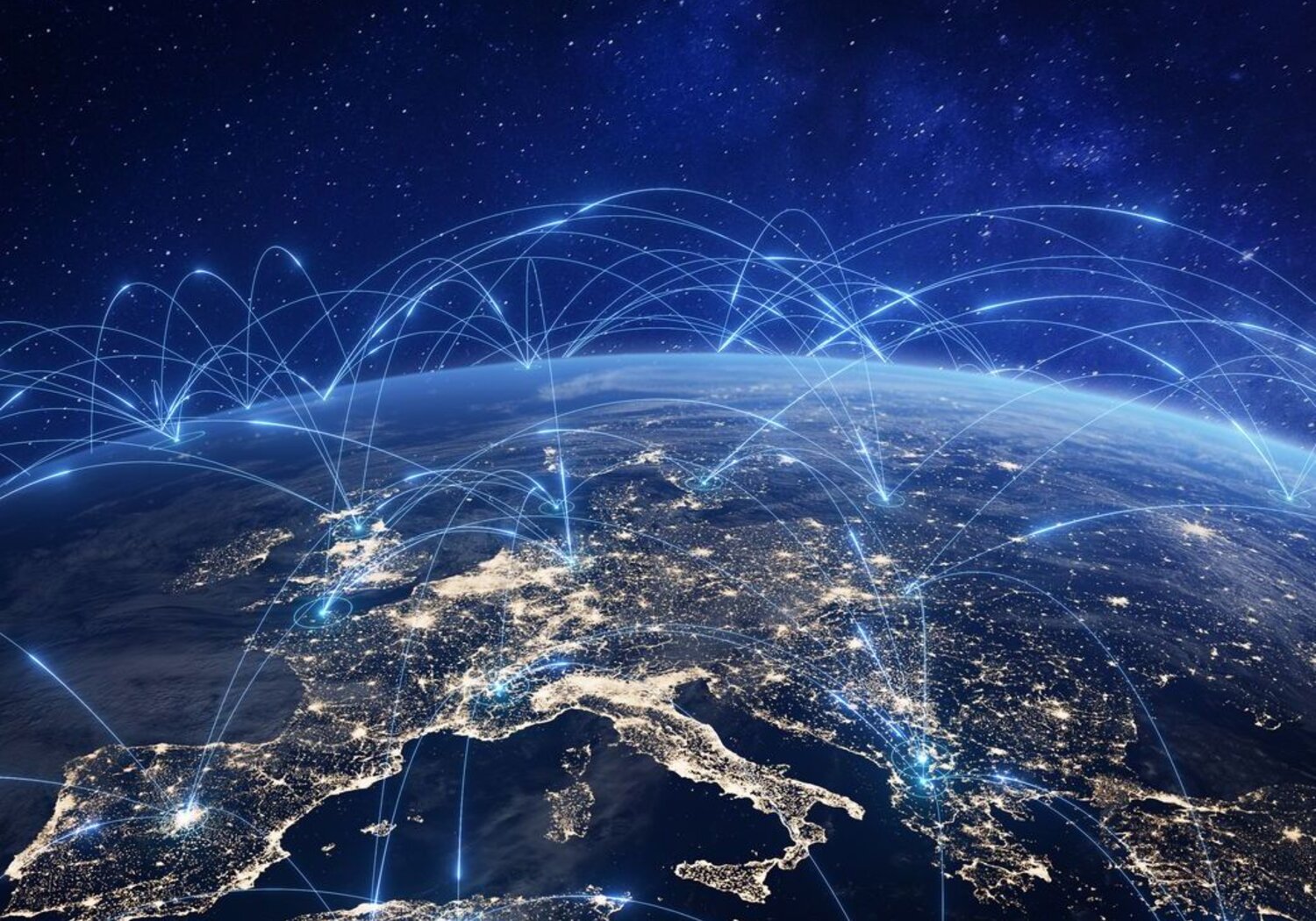 Image showing the concept of communication technology in Europe. Against a starry background the curve of the Earth is shown, with arcs of blue light connecting towns and cities in Europe.