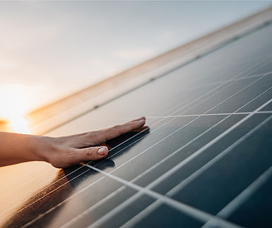 Image showing a hand touching a solar panel