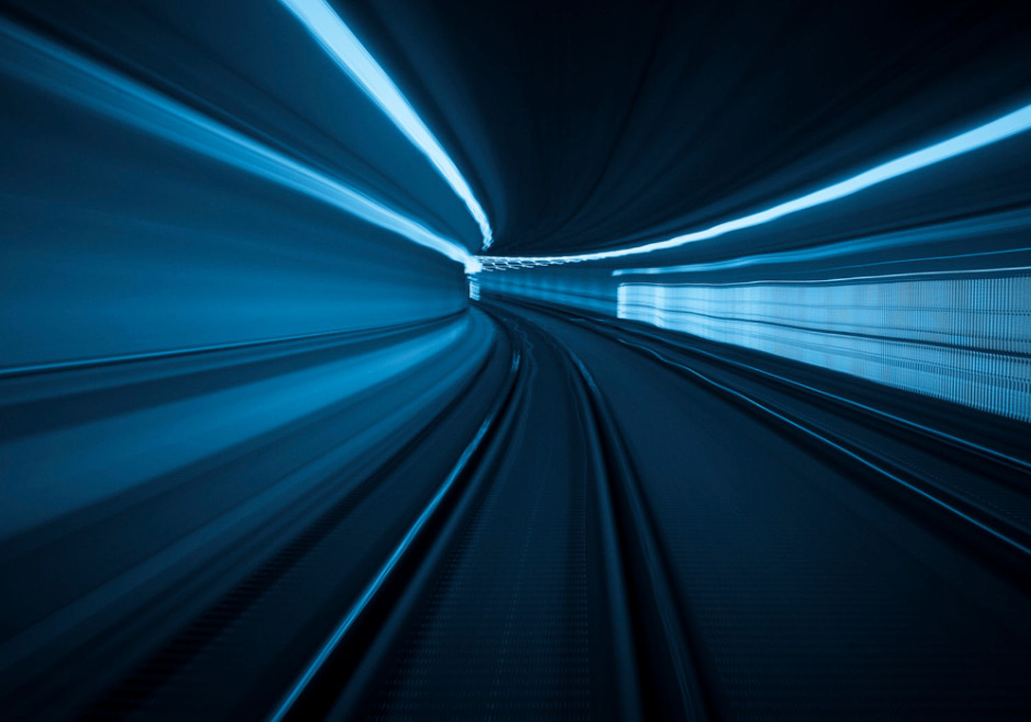 Image showing blue-white light trails in a tunnel