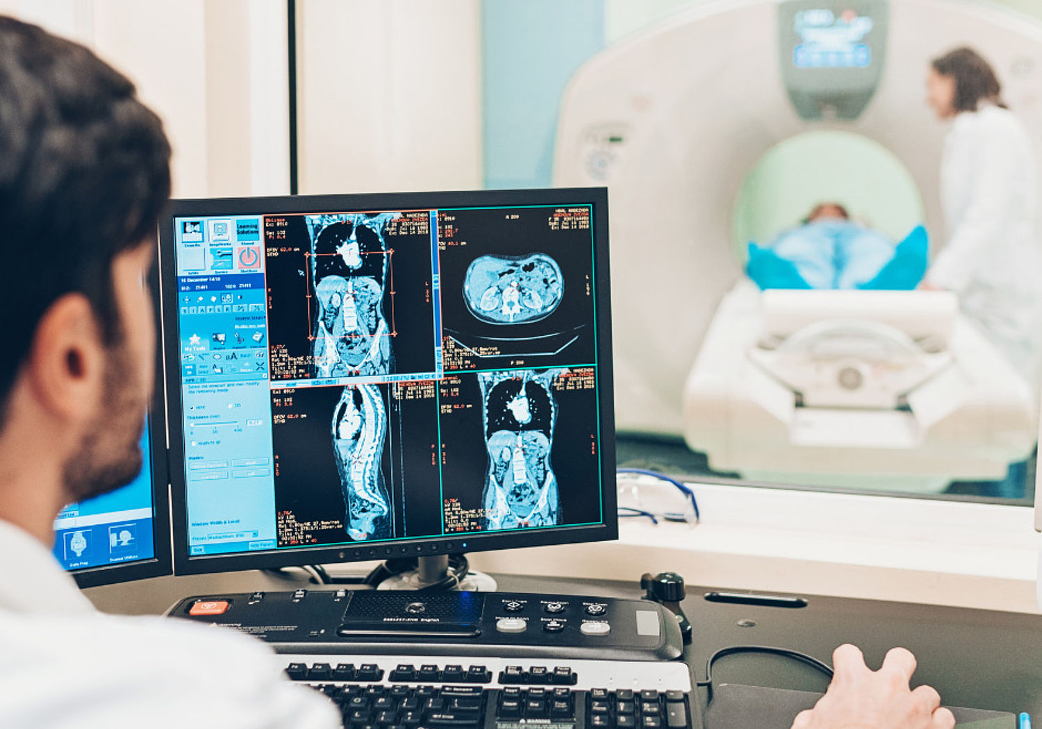 Image showing a doctor looking at a patient's MRI scan results