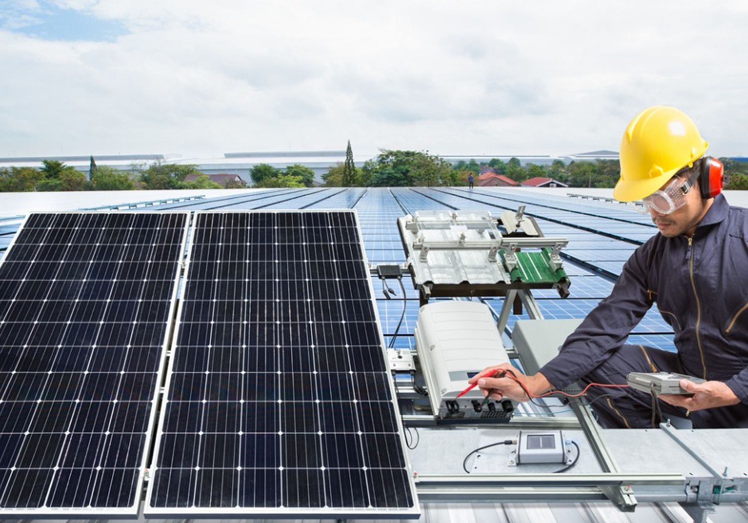 Image showing an engineer performing maintenance on solar panel equipment 