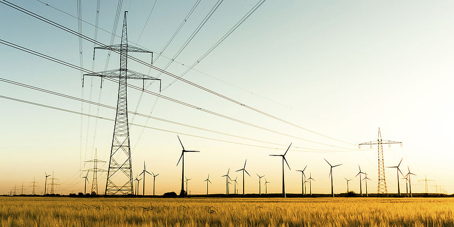 Image showing power lines and wind turbines in autumn sunlight