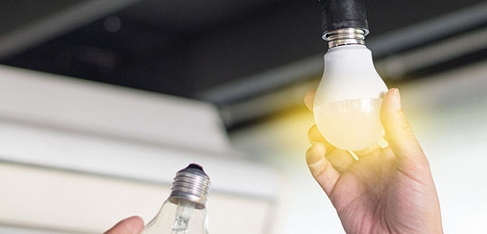 Consumer changing incandescent lamp with a new LED light bulb