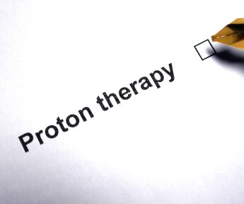 Image showing a box being ticked next to the words Proton Therapy