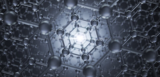 A grey and silver image of lattice of carbon atoms receding into the distance in a hexagonal structure similar to that of diamond