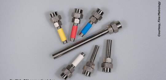 Against a grey background are seven different types of WaferCal permeation tubes from the company Fine Metrology. These resemble “nuts and bolts” with different coloured bands on the “bolt” of the tubes