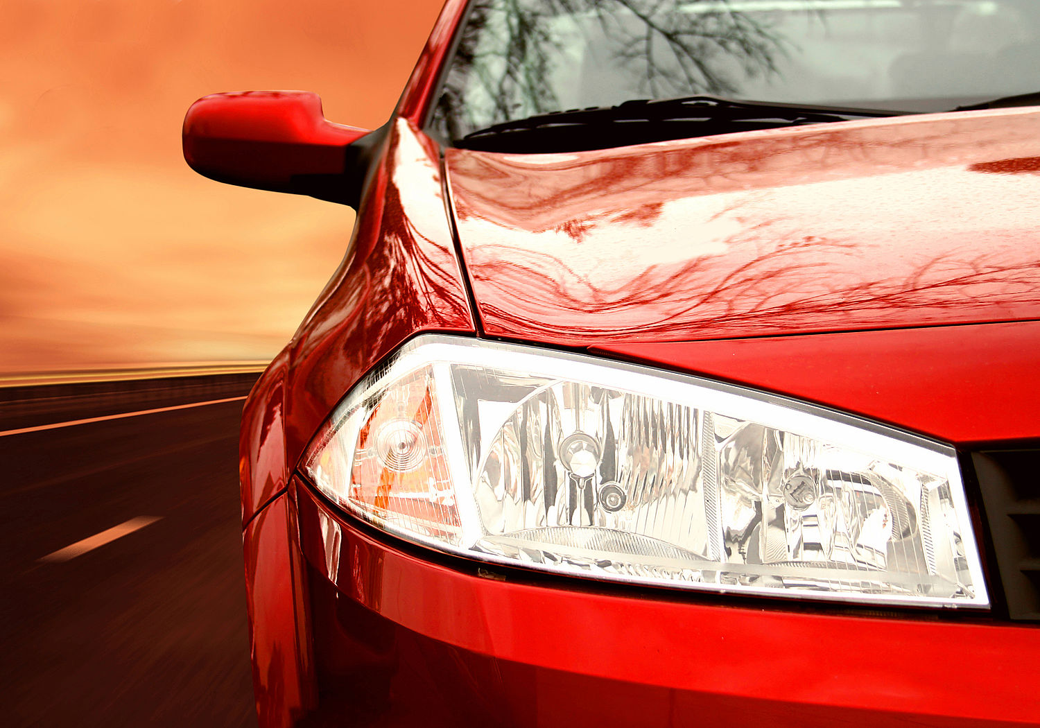 Image showing the right side of a red sportscar on a highway