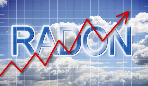 Schematic representation of radon levels increasing in the air. Against a blue sky with white clouds a red arrow climbs upwards over the words RADON in large letters