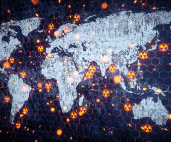 A stylised image of the world with the continents in white and the oceans in deep blue. Dotted around the land and oceans are nuclear hazard symbols representing nuclear explosions or tests
