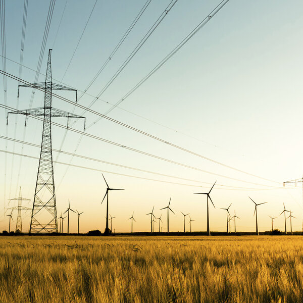 Image showing power lines and wind turbines in autumn sunlight