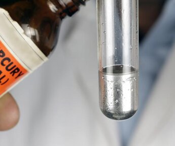 Image showing mercury metal being poured into a test tube