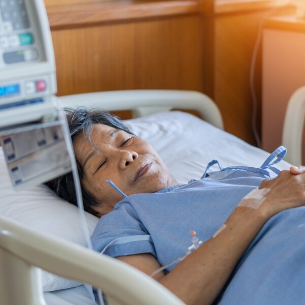  An elderly patient in a hospital bed
