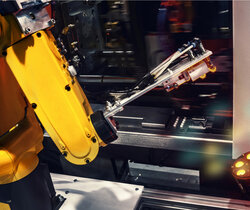Image of a industrial robotic arm in a factory