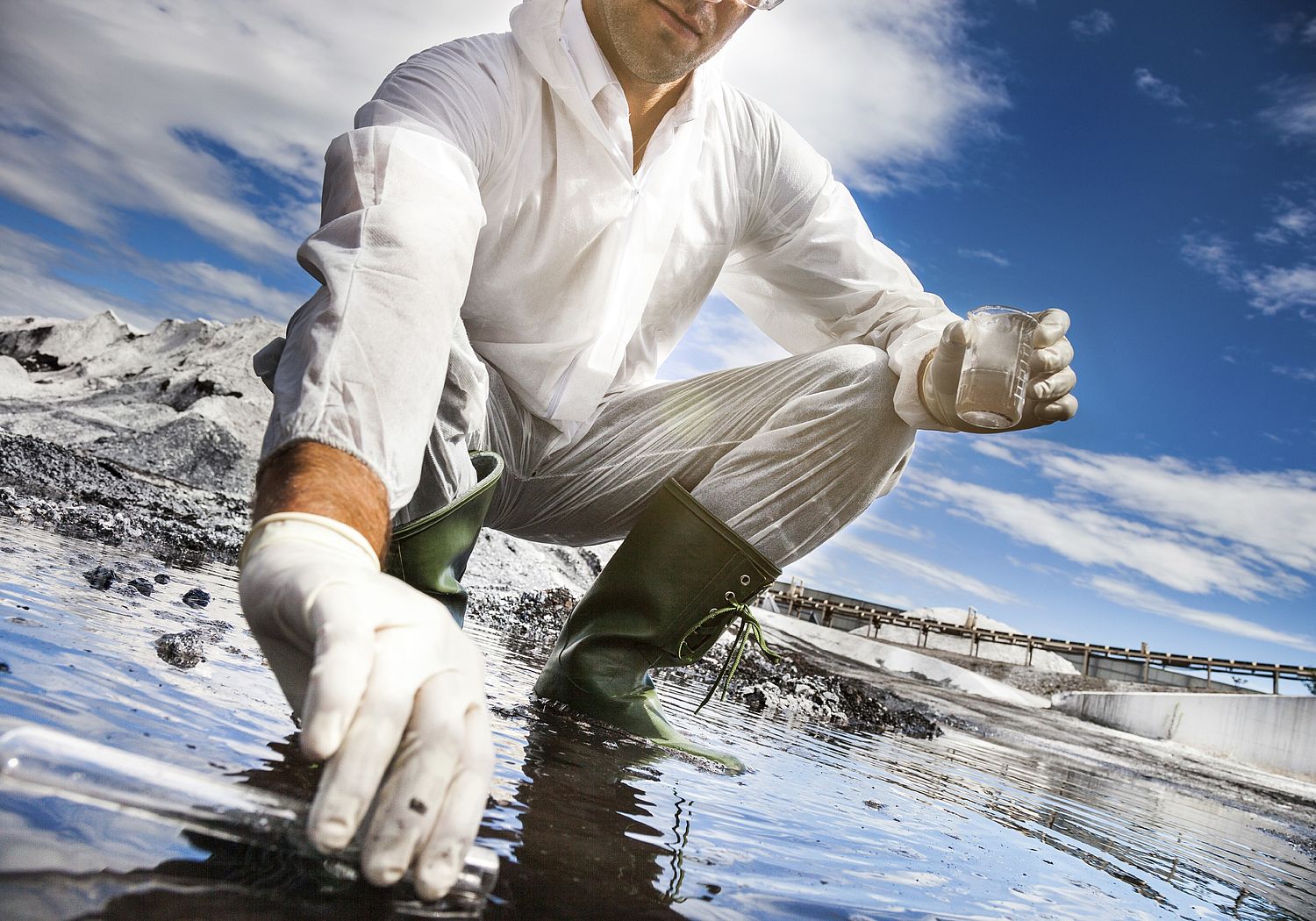 Image showing Scientist analysing the water of a river