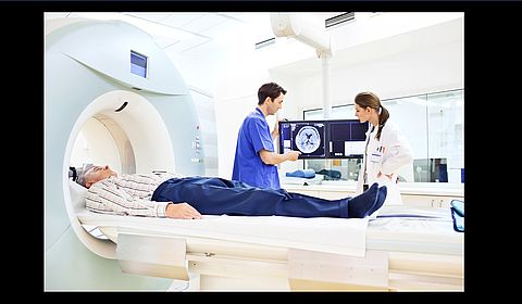 Image showing Two doctors discussing a CAT scan