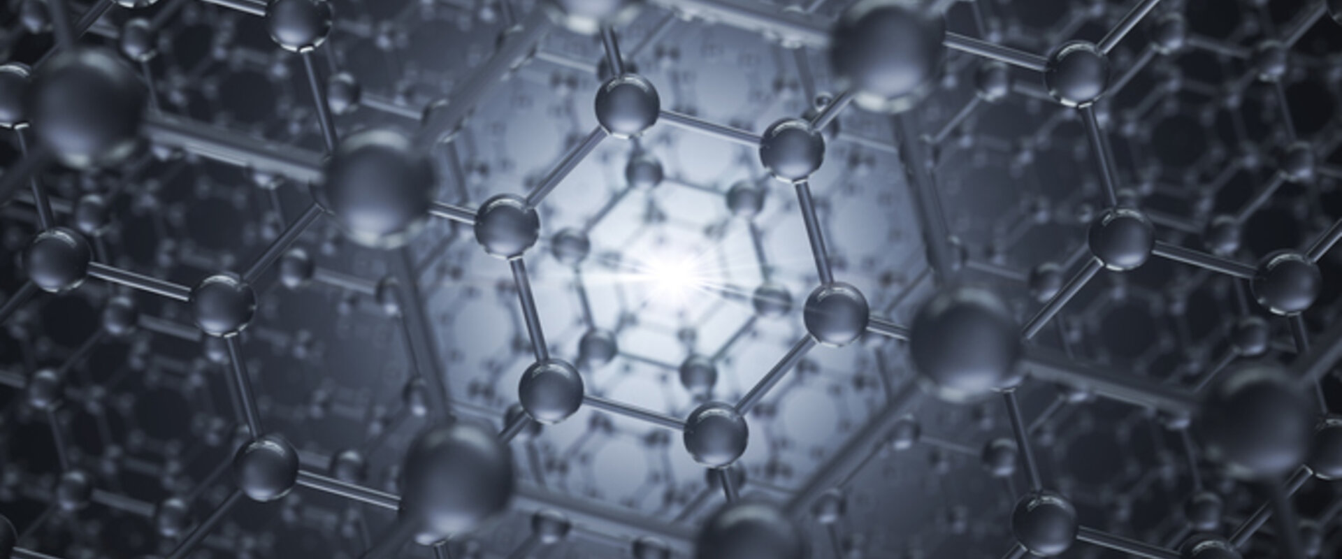 A grey and silver image of lattice of carbon atoms receding into the distance in a hexagonal structure similar to that of diamond