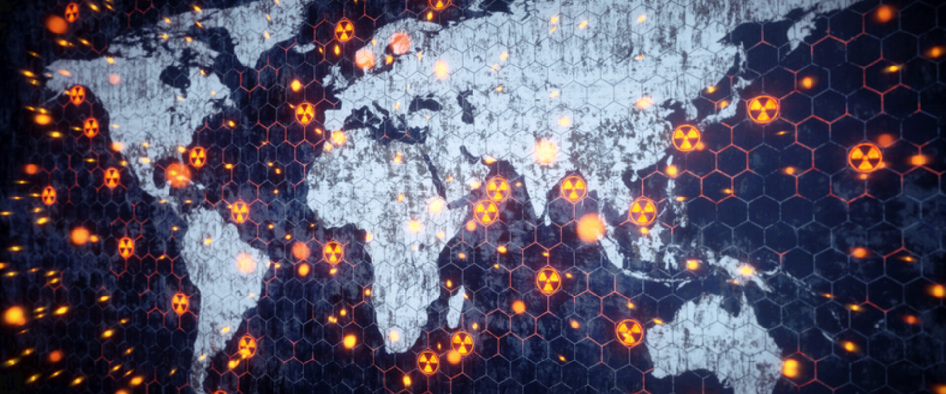 Stylised image of the World indicating nuclear events A stylised image of the world with the continents in white and the oceans in deep blue. Dotted around the land and oceans are nuclear hazard symbols representing nuclear explosions or tests