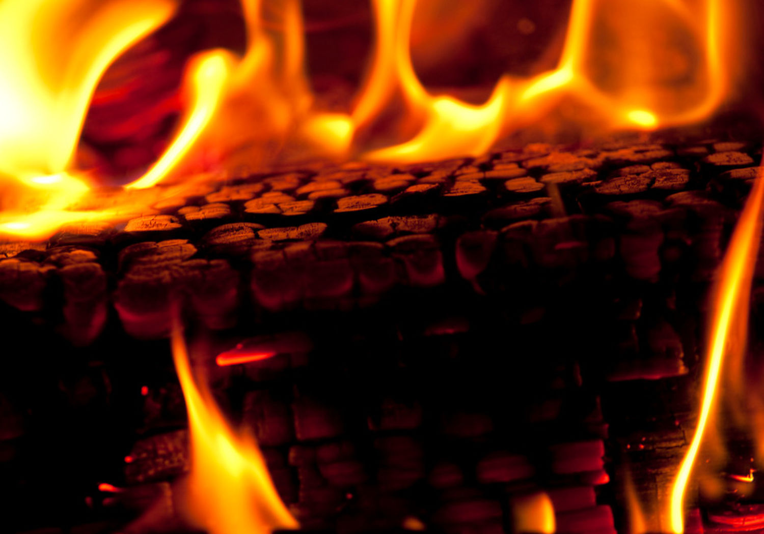 Image showing a wooden log burning on a fire