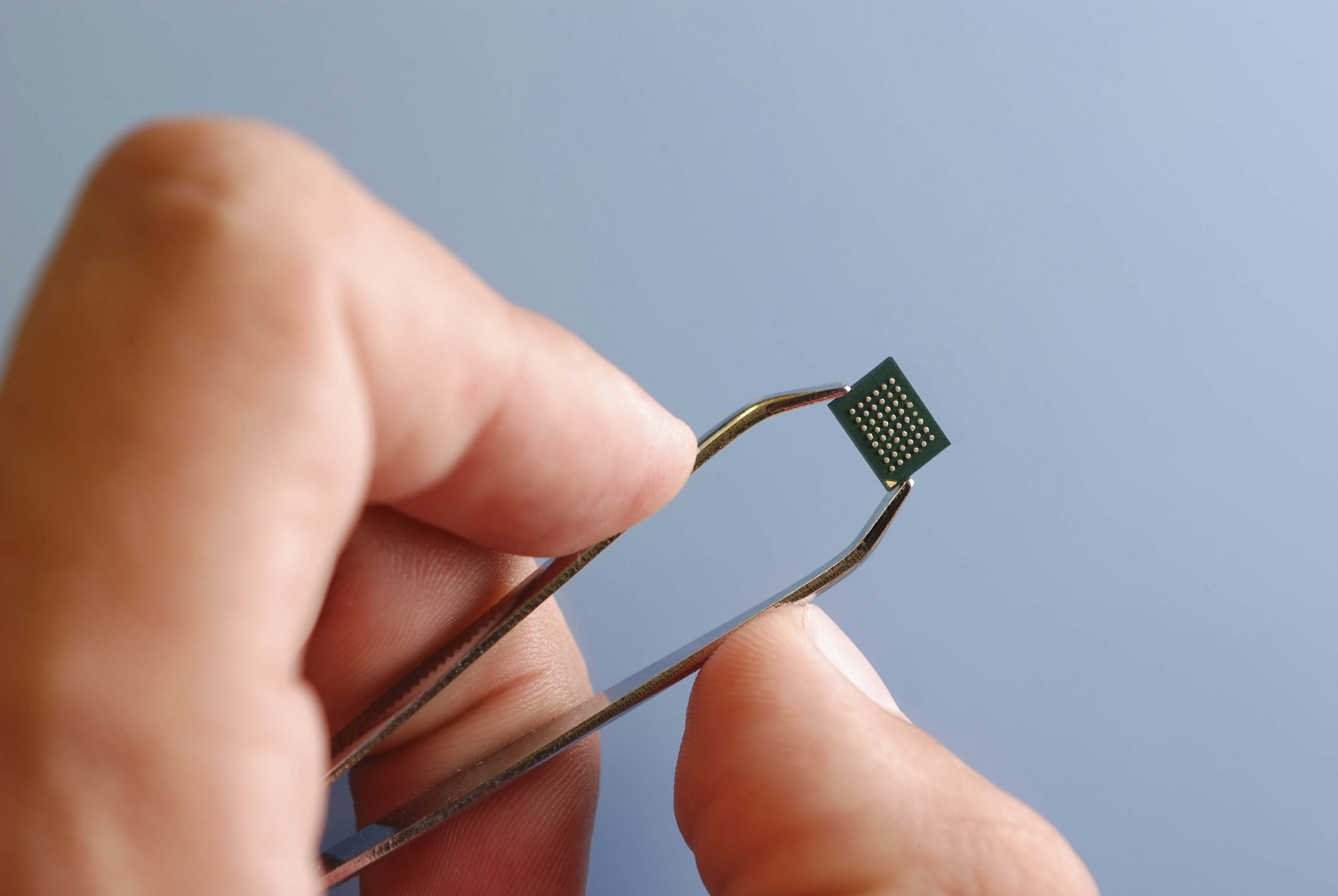 Man handling small chip - Project Picture IND54