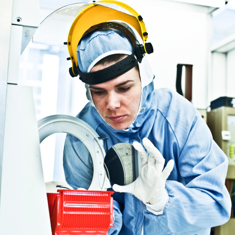 Image of a Scientist Working on Silicon Wafer Fabrication in Cleanroom 
