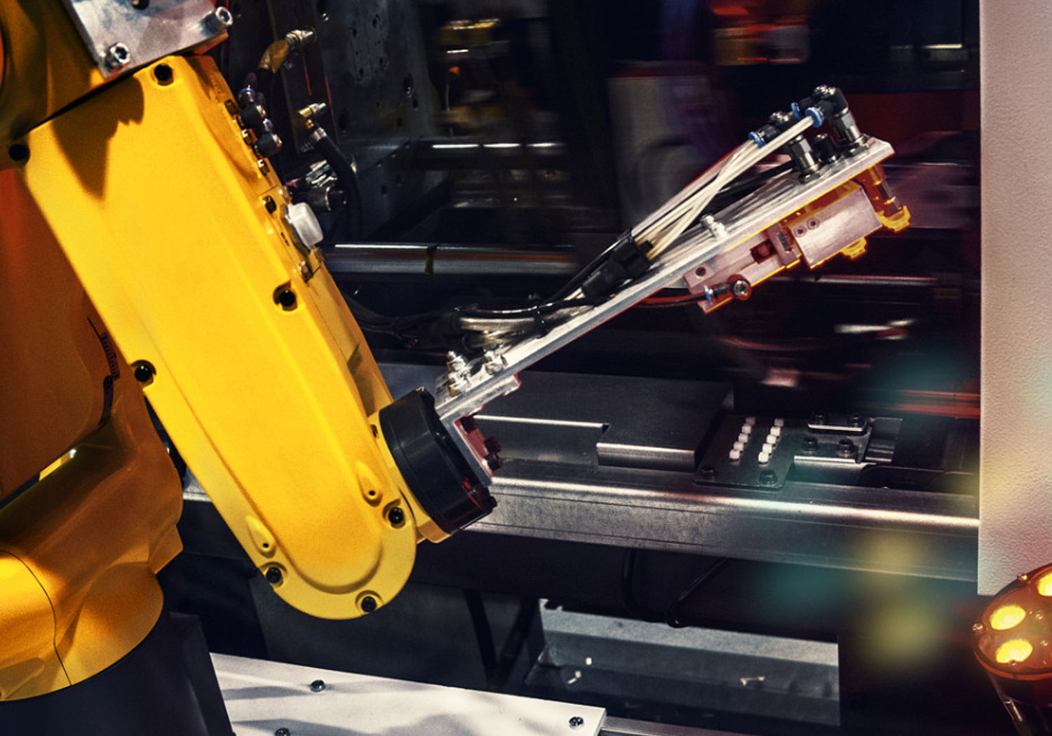 Image of a industrial robotic arm in a factory