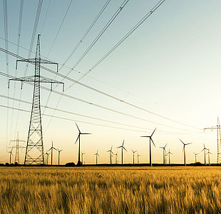 Image showing power lines and wind turbines in autumn sunlight