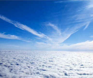 Image showing the view of clouds through the potral of a plane