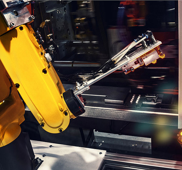 Image of a industrial robotic arm in a factory