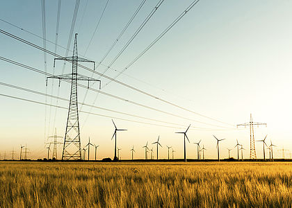Image showing power lines and wind turbines in autumn sunlight