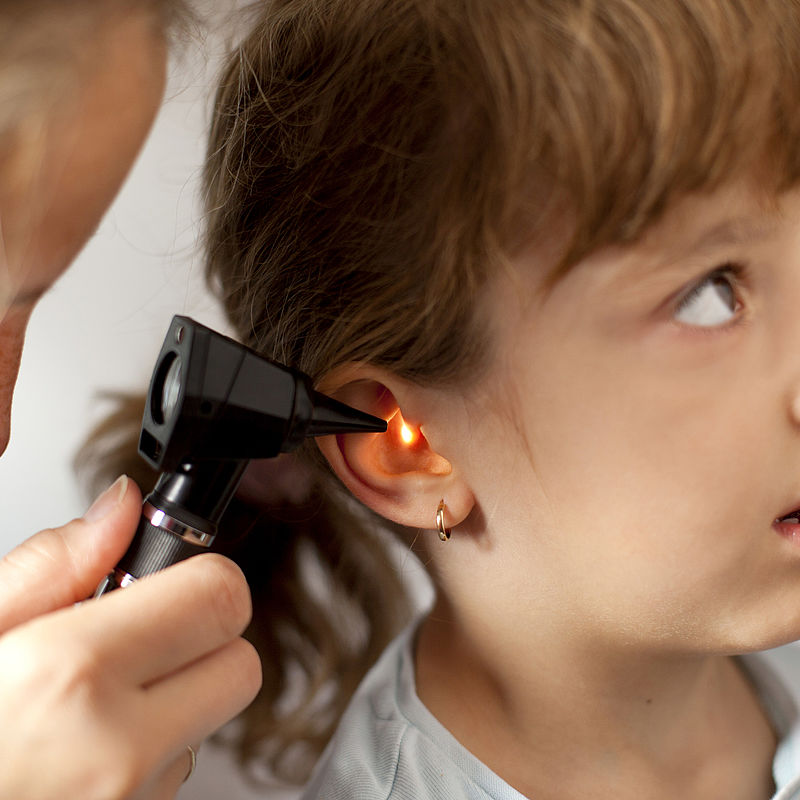 Image showing a Paediatrician performing an ear exam of a young patient