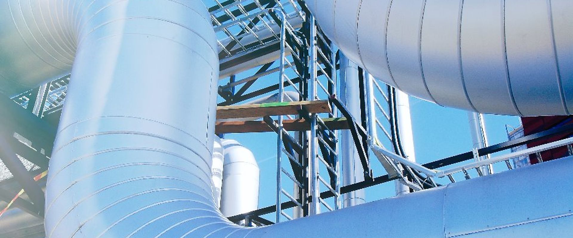 Equipment cables and piping as found inside of a modern industrial picture id916013526