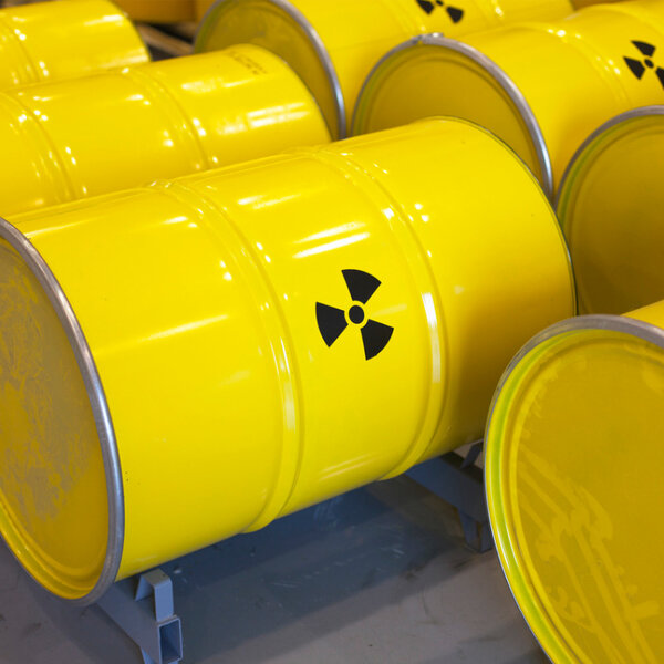 Image showing rows of yellow radioactive waste barrels