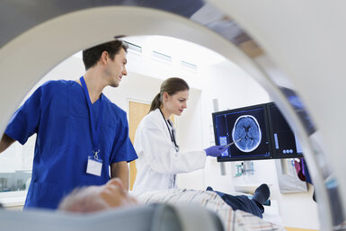 Image showing doctors performing a scan on a patient