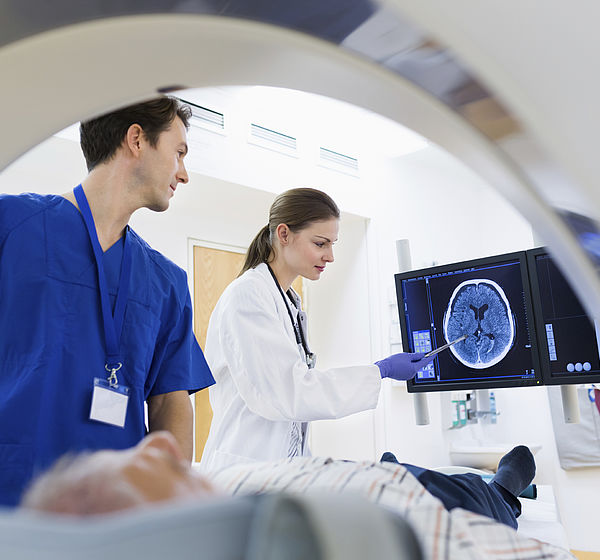 Image showing doctors performing a scan on a patient