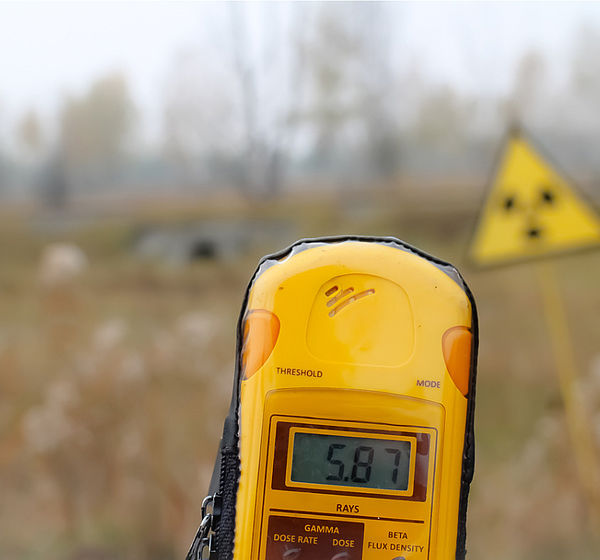Image showing a Dosimeter and radiation warning sign