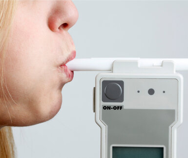 Image showing a person blowing in breathalyser