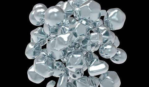 Against a black background is a 3D illustration of zinc oxide nanoparticles. Silver in colour, a roughly spherical shape, around 50 particles are clumped into a ball in the centre of the image