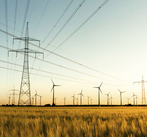 Image showing power lines and wind turbines in autumn sunlight