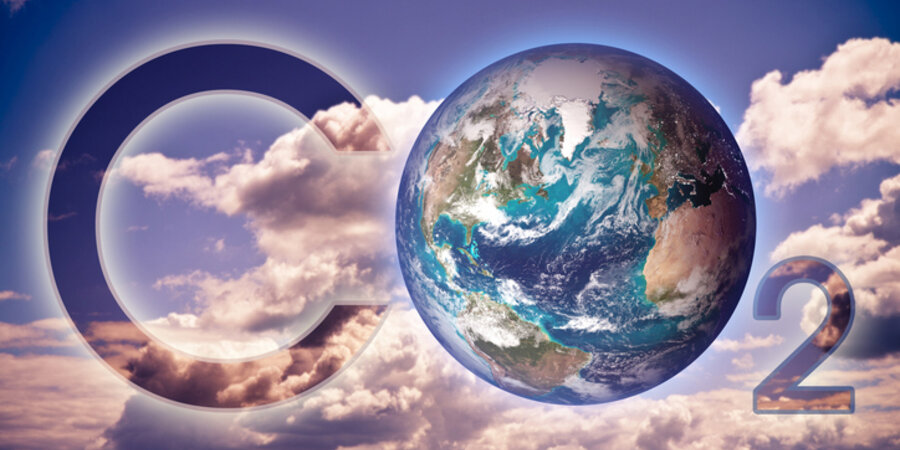 In the background are white clouds and a blue sky and set against these are the words “CO₂” with the “O” represented by the planet Earth