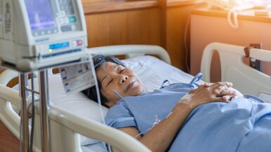  An elderly patient in a hospital bed