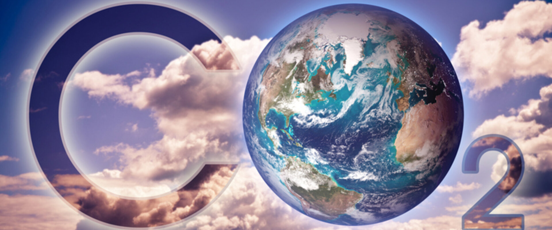 CO₂ in the atmosphere is a powerful greenhouse gas In the background are white clouds and a blue sky and set against these are the words “CO₂” with the “O” represented by the planet Earth