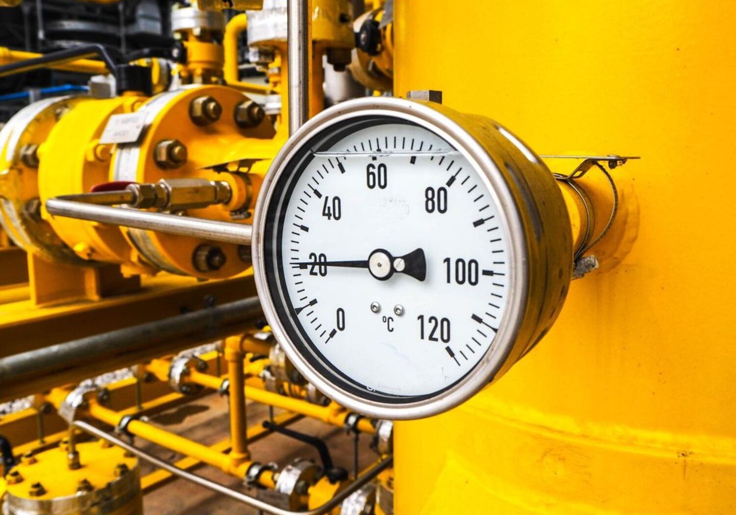 Image showing an analogue dial reading temperature in an industrial enviroment