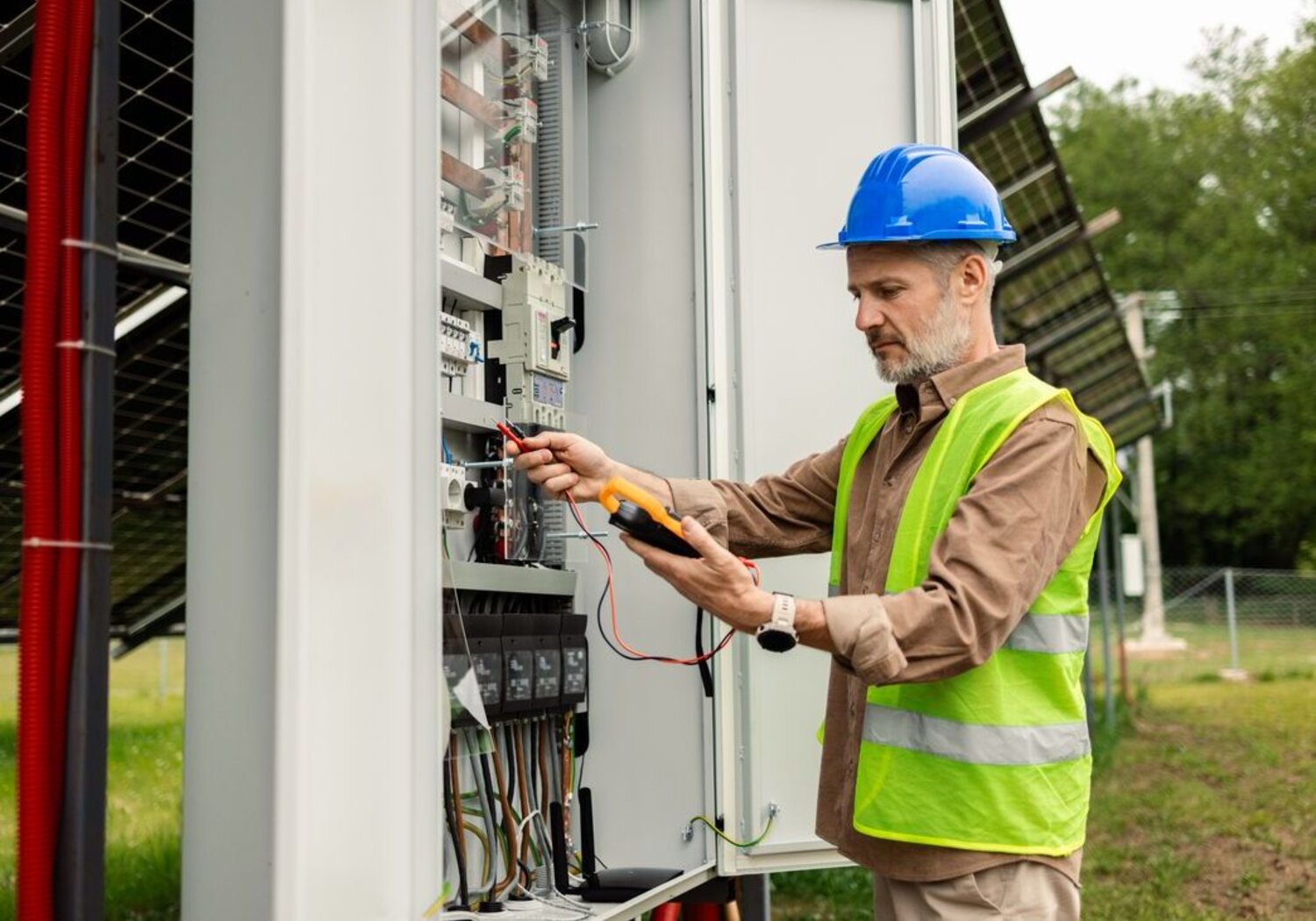 Image showing an electrical engineer analysing a solar power array