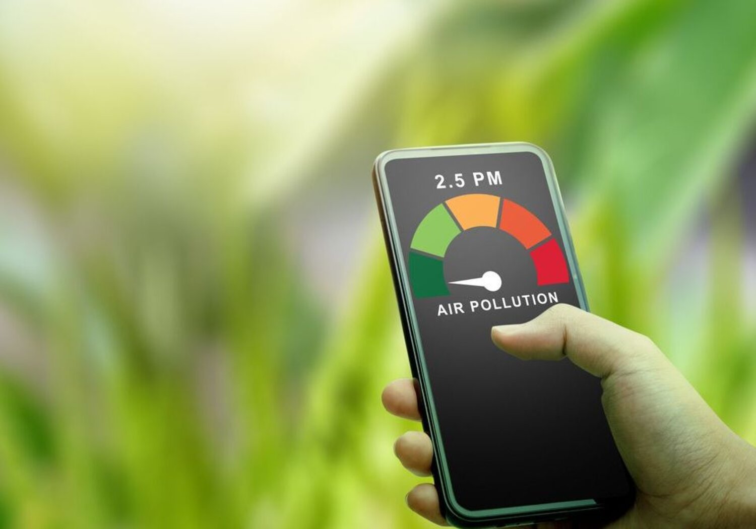 Image showing a hand holding a meter indicating good air quality