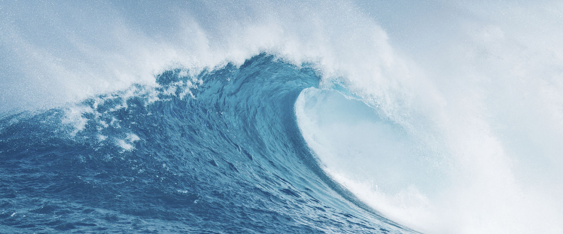 Crashing ocean wave against blue sky in hawaii - Project Picture ENV05
