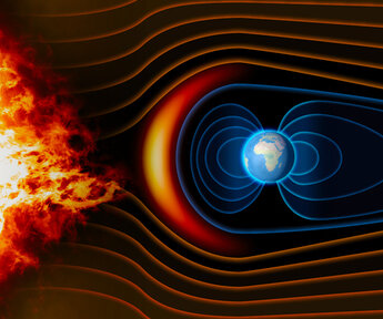 On the left-hand side of the image is the sun with fiery solar flares extending across the picture to the Earth on the right-hand side. Here the Earth’s magnetic field is acting like a “shield” diverting the fire around the planet