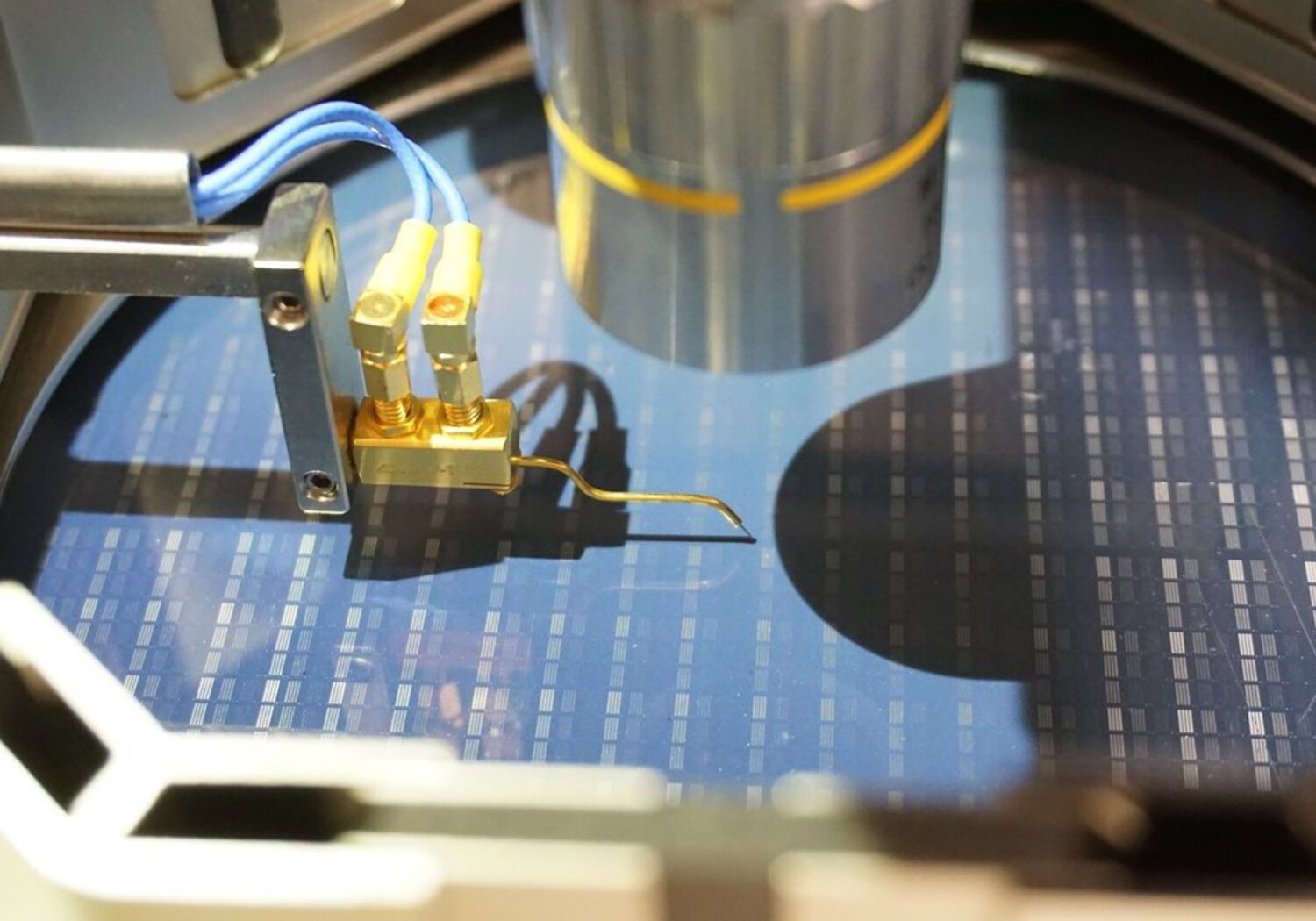 Image showing a computer wafer being measured with a test probe