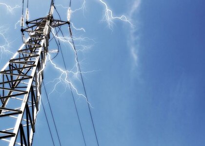 A high voltage electrical pylon with lightning bolts