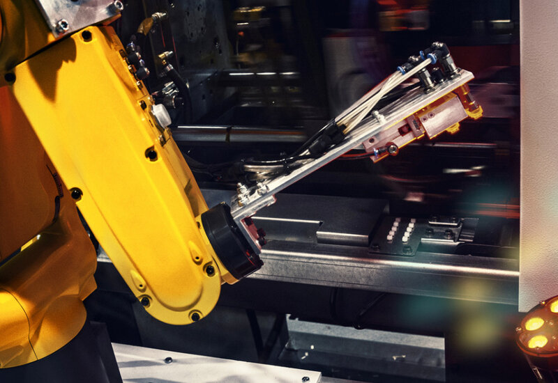 Image of a industrial robotic arm in a factory
